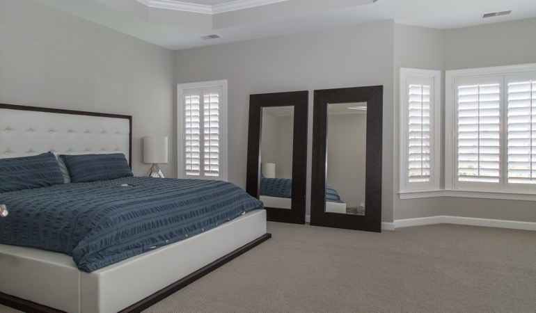 White shutters in a minimalist bedroom in Orlando.
